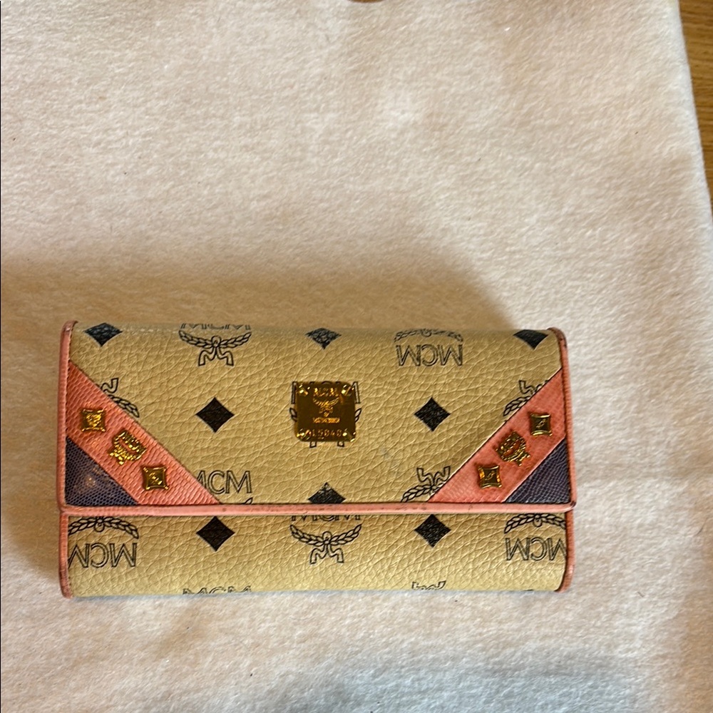 MCM Cream and Pink Wallet with Monogram Design.